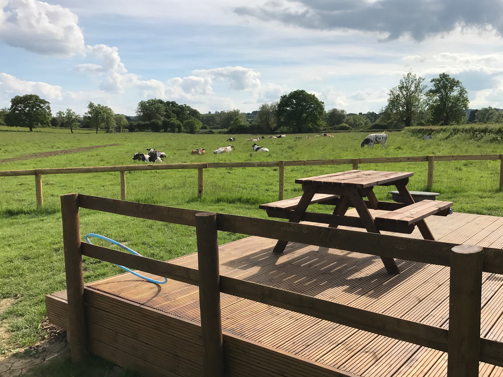 Luxury glamping pods with outdoor decking at Evenlode Grounds Farm