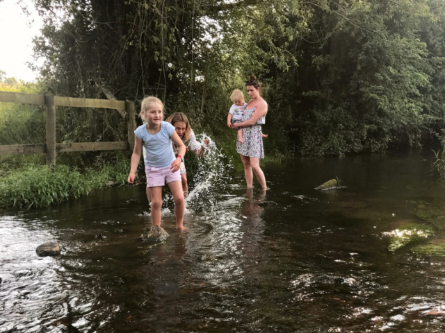 Playing in the stream at Evenlode Grounds Farm