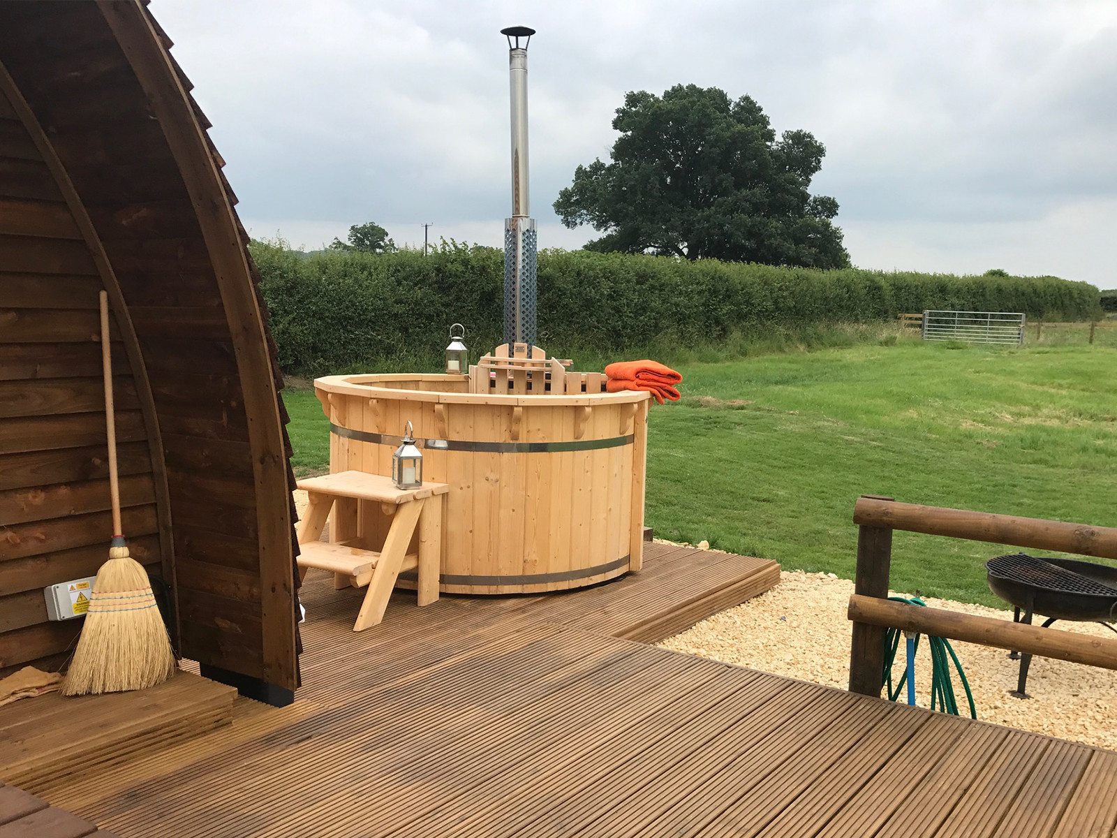 Luxury glamping pods with wood fired hot tubs at Evenlode Grounds Farm